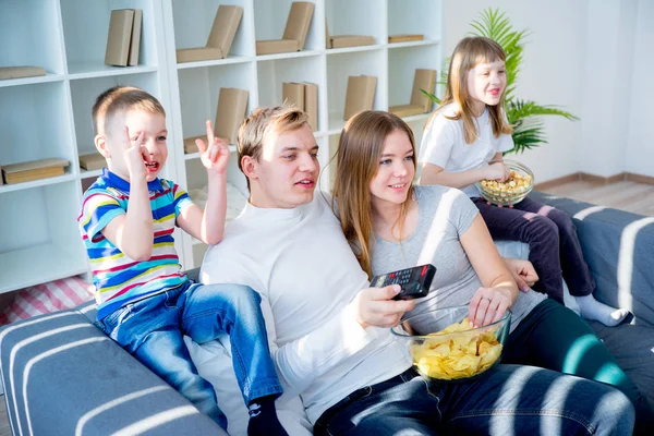 Family watching a film