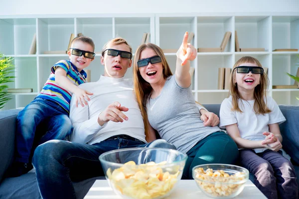 Family watching a 3d movie