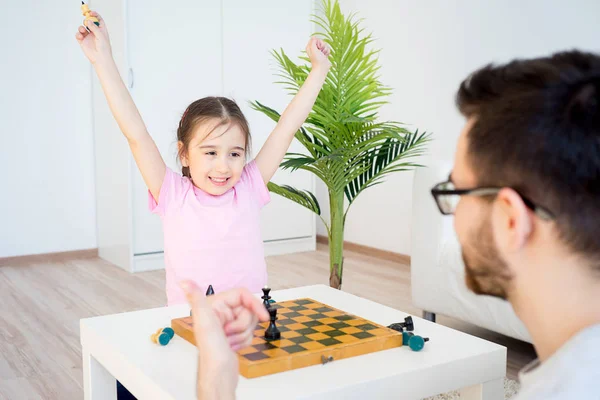 Family playing chess