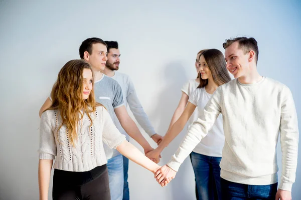 Friends holding hands — Stock Photo, Image
