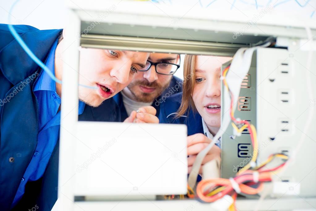 Technicians repairing computers