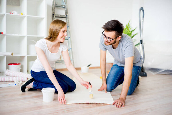 Couple renovating apartment