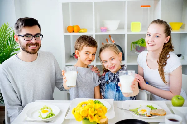 Family drinks milk for breakfast