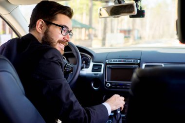 Happy man driving a car