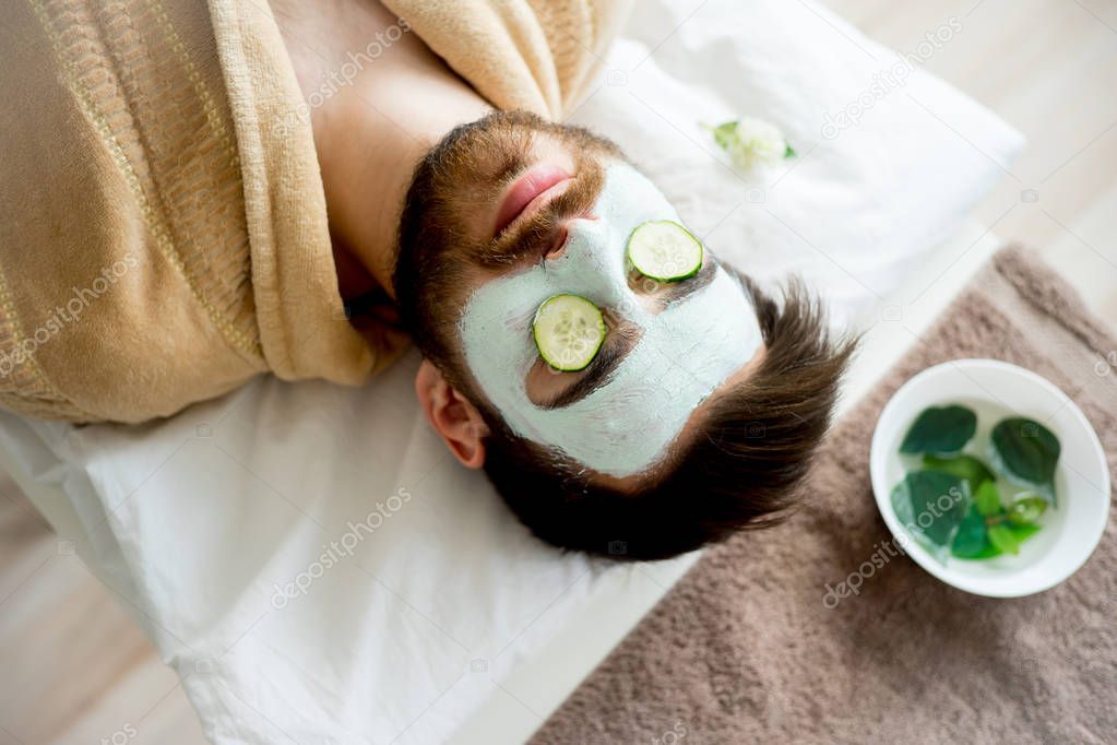 Man with a clay mask