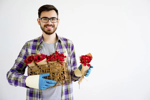 Male gardener with flowers — Stock Photo, Image