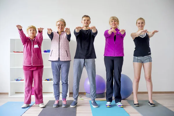 Group of elderly people doing exercises