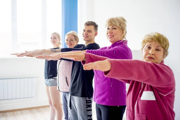 Group of elderly people doing exercises