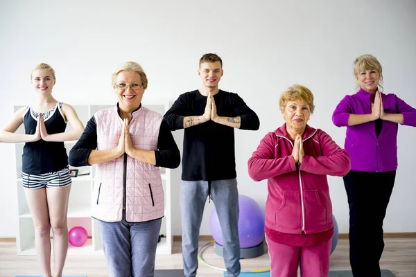 Group of elderly people doing exercises