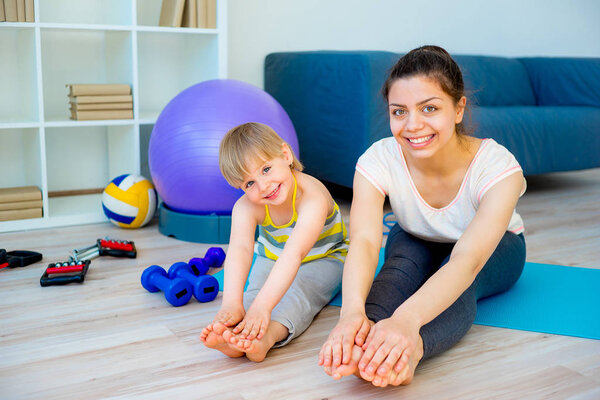 Mother is doing yoga
