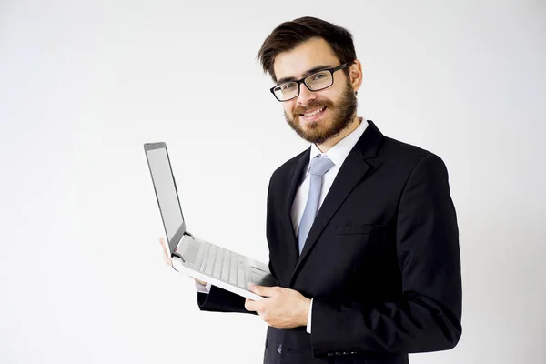 Uomo d'affari con un computer portatile — Foto Stock