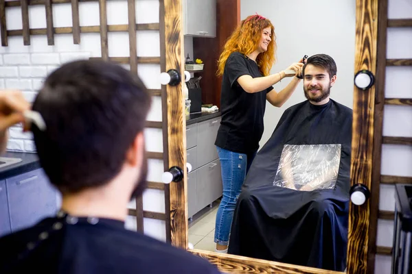 Barber dressing hair