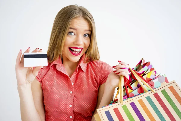 Pretty girl with shopping bags Stock Picture