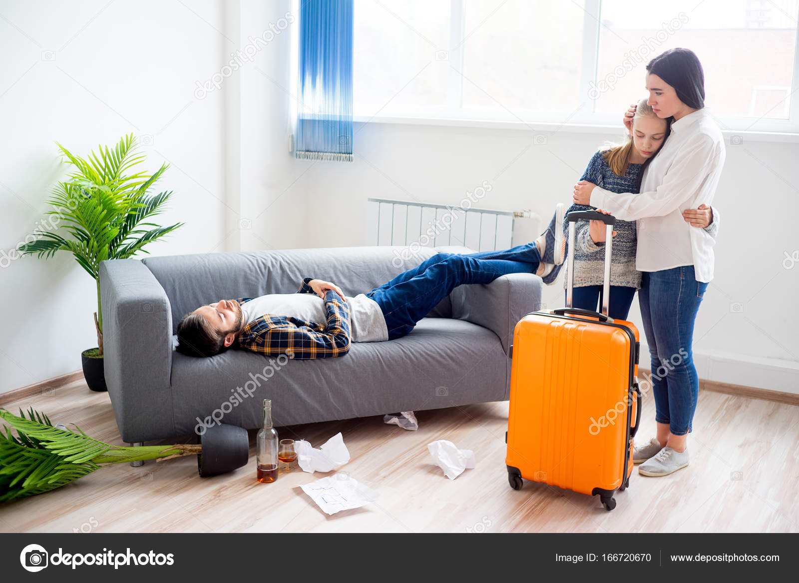 Wife is leaing alcoholic husband Stock Photo by ©Lenanichizhenova 166720670