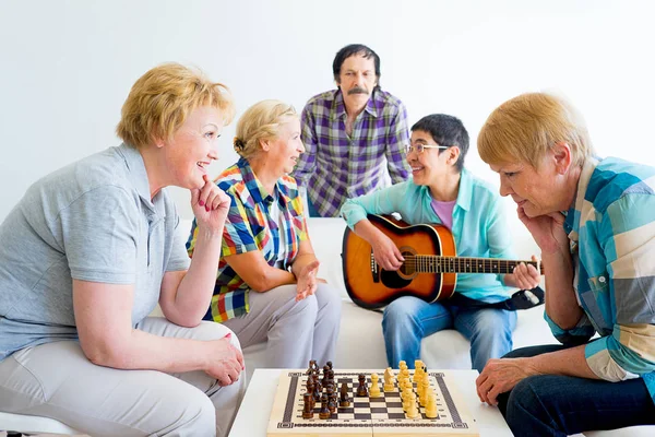 Senior people playing board games