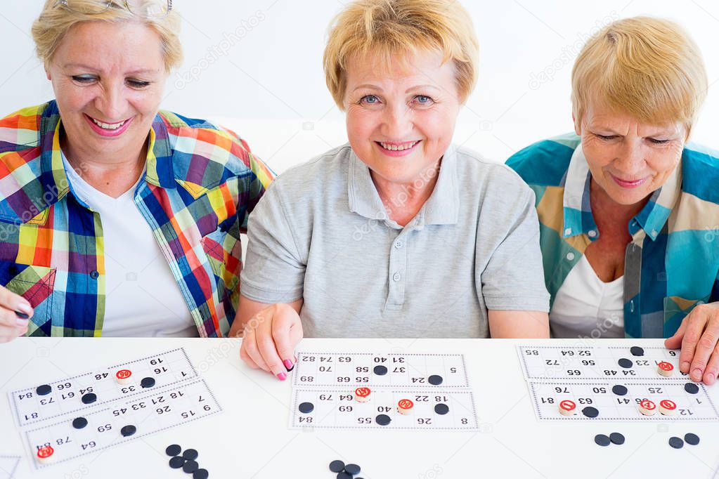Senior people playing board games