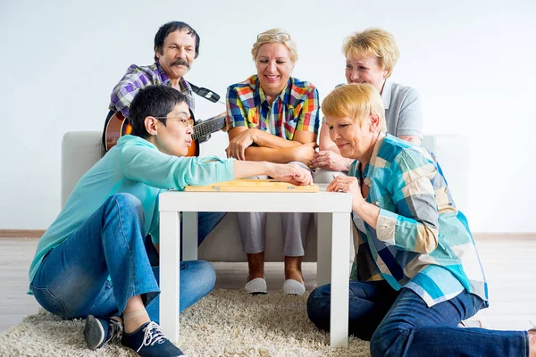 Senior people playing board games