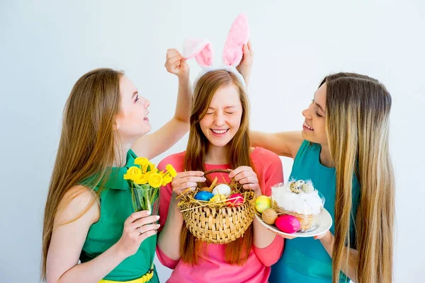 Three female friends celebrating easter