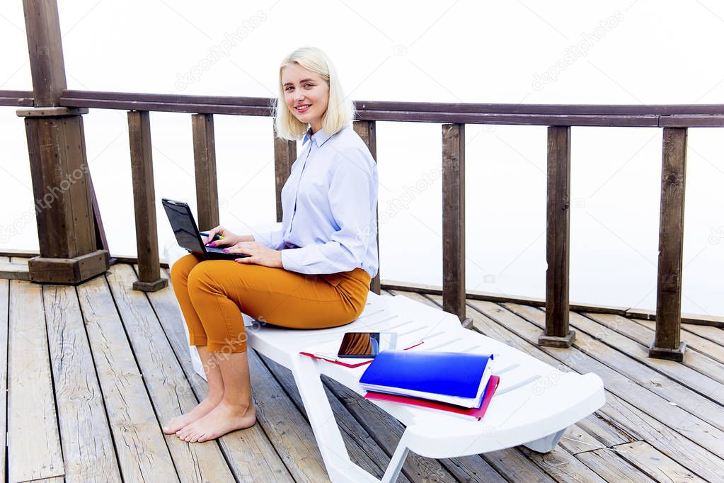 Businesswoman working on a beach