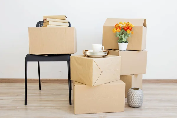 Many cardboard boxes in bright house during relocation Stock Photo by