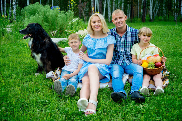 Family picnic with a dog