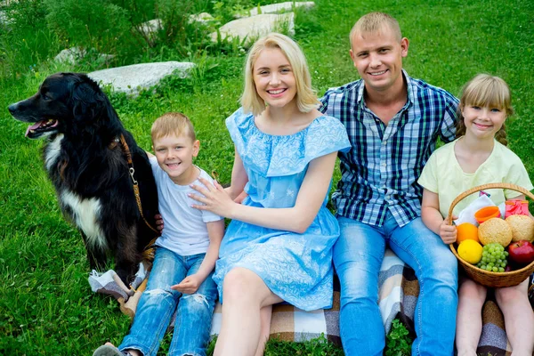 Family picnic with a dog