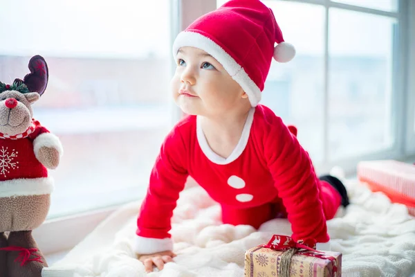 Baby in a christmas hat — Stock Photo, Image