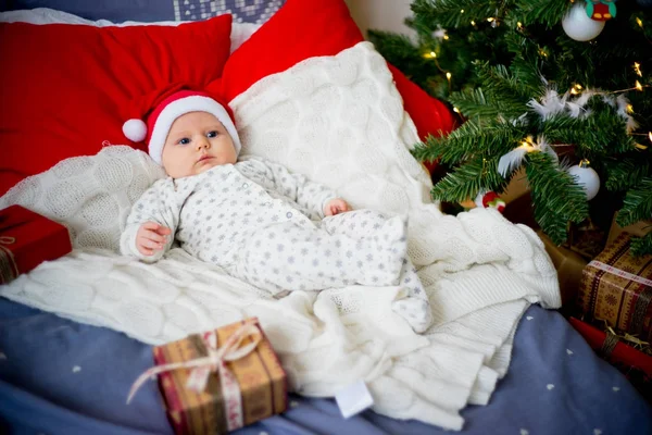 Baby in a christmas hat — Stock Photo, Image