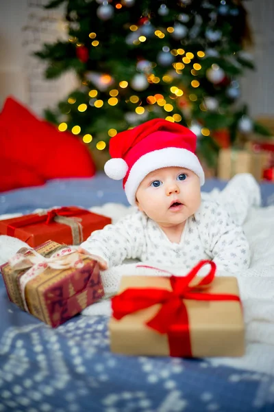 Baby in a christmas hat — Stock Photo, Image