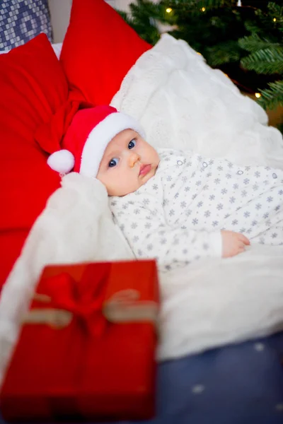 Baby in a christmas hat Royalty Free Stock Images