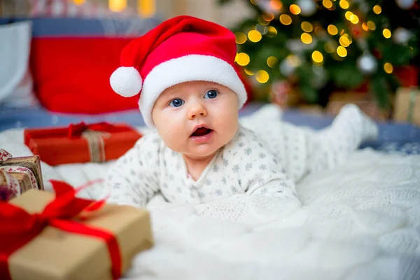 Baby in a christmas hat — Stock Photo, Image