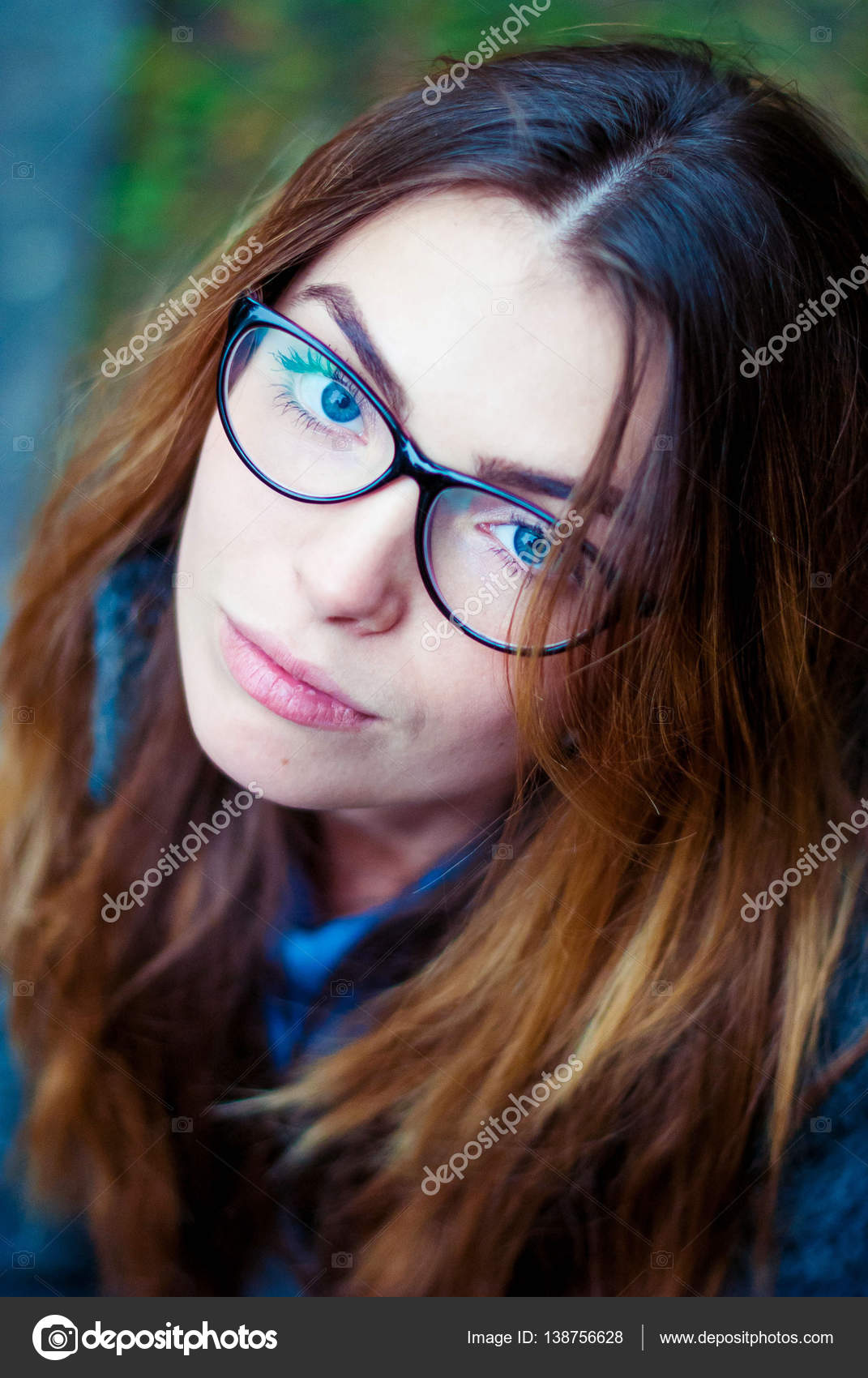 Sad Beautiful Girl In Glasses With Blue Eyes Stock Photo