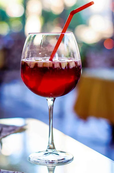 Spanish wine cold sangria drink in a glass with pieces of fruit — Stock Photo, Image