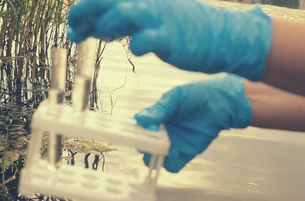 Taking a water test for analysis from a reservoir. — Stock Photo, Image