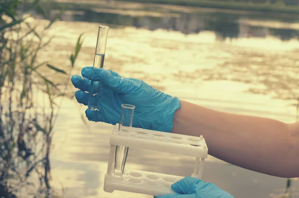 Taking a water test for analysis from a reservoir. — Stock Photo, Image