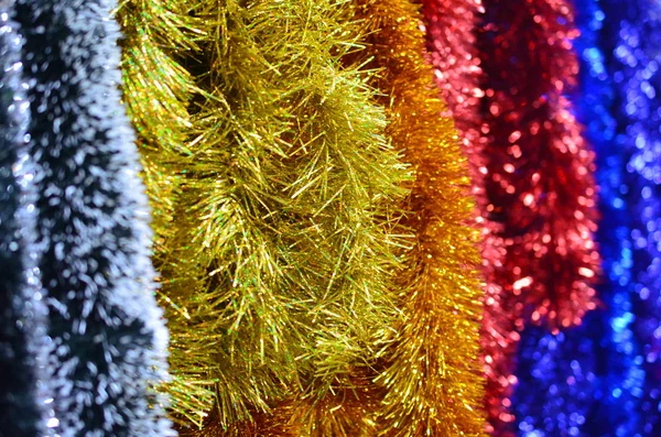 Multicolored Christmas fluffy tinsel of foil. Stock Photo