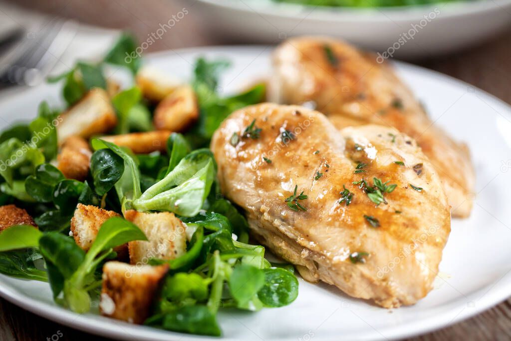Grilled chicken breast with salad