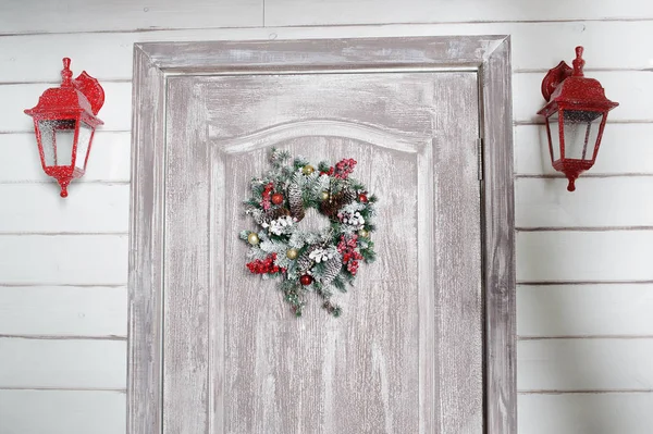 Christmas wreath on door in the interior