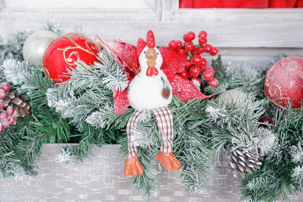 The symbol of the new 2017 rooster on the background of Christmas decorations — Stock Photo, Image