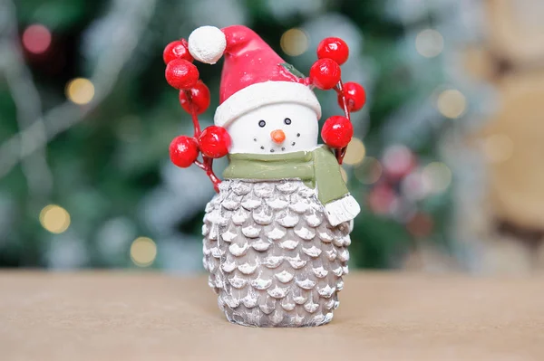 Toy snowman on the background of Christmas tree — Stock Photo, Image