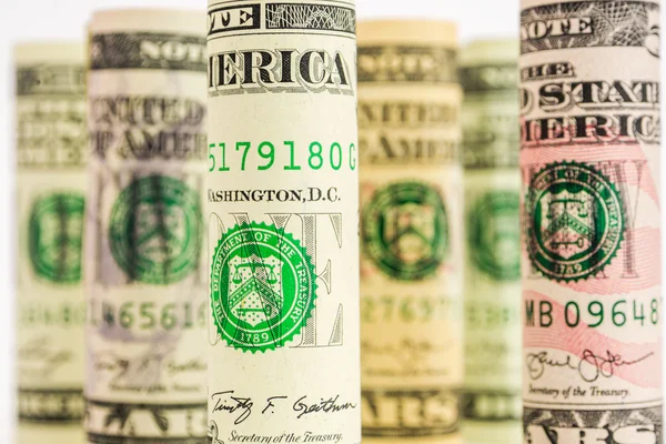 Playing with focus of american dollar banknote rolls — Stock Photo, Image