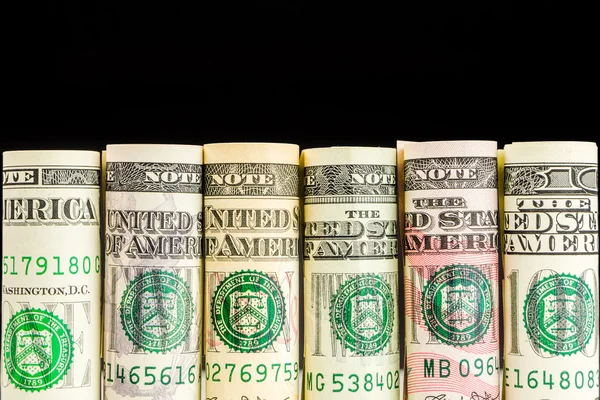Rolls of american dollar banknotes in one row — Stock Photo, Image