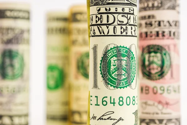 Playing with focus of american dollar banknote rolls — Stock Photo, Image