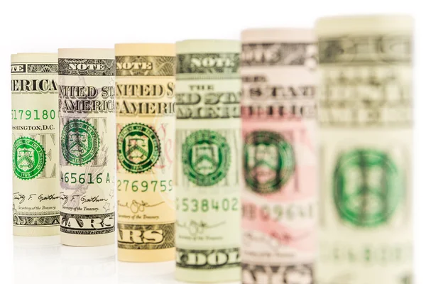 Rolls of american dollar banknotes in one row — Stock Photo, Image