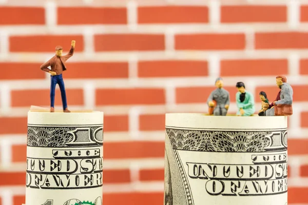 Miniature figurines discussion on the edge of 100 dollar bill — Stock Photo, Image