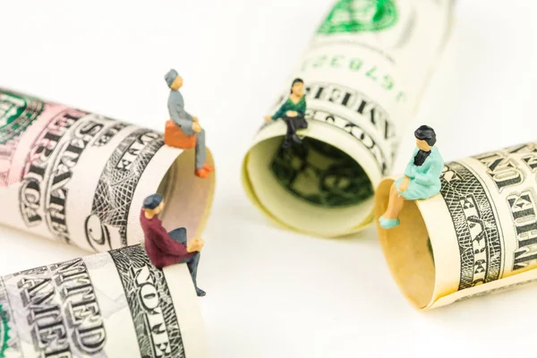 Miniature figurines discussion on the edge of 100 dollar banknote — Stock Photo, Image