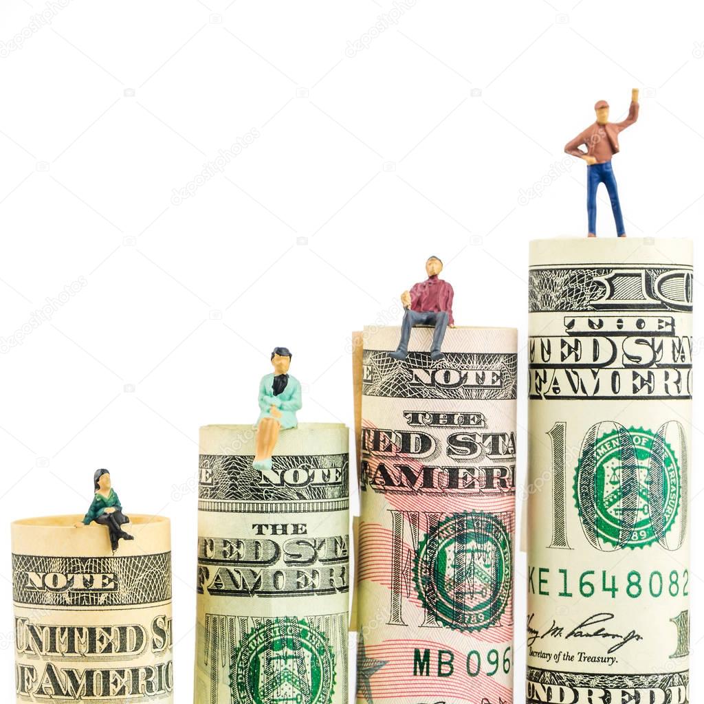 miniature figurine with victory gesture on most valued american dollar banknote