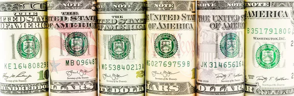 Rolls of american dollar banknotes in one row — Stock Photo, Image