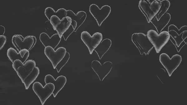 Herzzeichen auf schwarzer Kreidetafel gezeichnet — Stockfoto