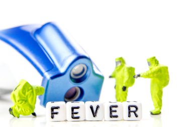 Sıcaklığı modern termometre, hugh humması ve korona gribi salgını ile ölçen minyatür figürlerden oluşan bir ekip.